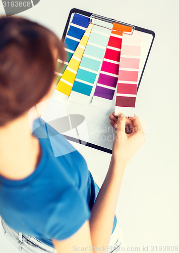 Image of woman working with color samples for selection