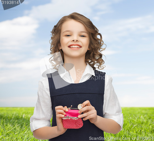 Image of happy girl with purse and euro coin money