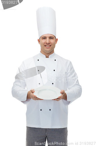 Image of happy male chef cook showing empty plate