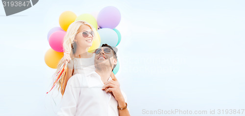 Image of couple with colorful balloons