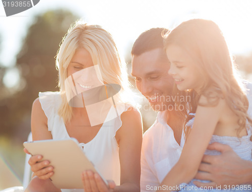 Image of happy family with tablet pc taking picture