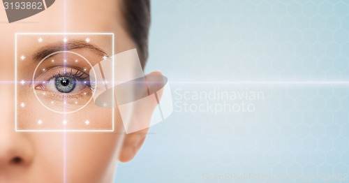 Image of beautiful young woman with laser light lines