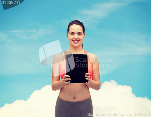 Image of sporty woman with tablet pc blank screen