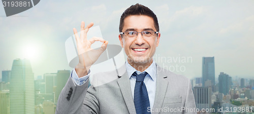 Image of happy smiling businessman in eyeglasses and suit