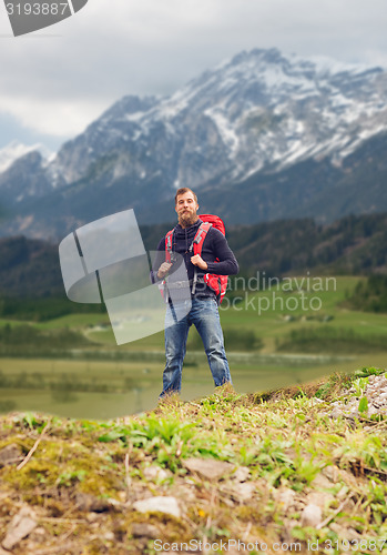 Image of tourist with beard and backpack