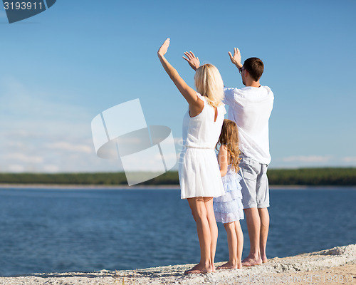 Image of happy family at the seaside