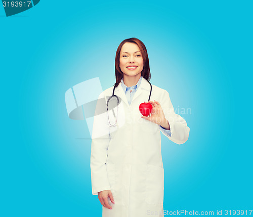 Image of smiling female doctor with heart and stethoscope