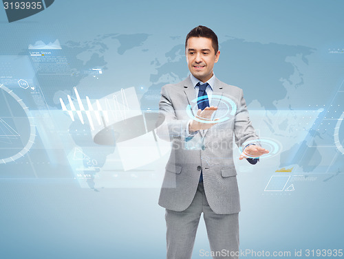 Image of happy businessman working with virtual screens