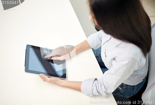 Image of close up of woman hands with tablet pc at office