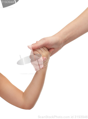 Image of close up of woman and little girl holding hands
