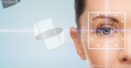 Image of beautiful young woman with laser light lines