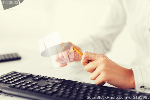 Image of woman breaking pencil