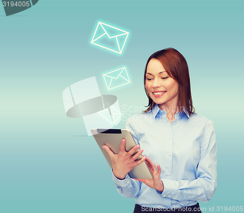 Image of smiling woman looking at tablet pc