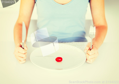 Image of woman with plate and one tomato