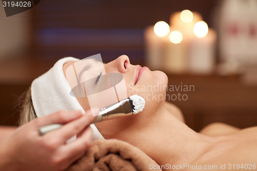 Image of close up of young woman and cosmetologist in spa