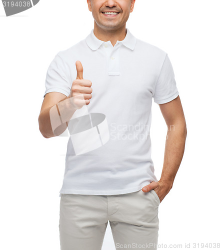 Image of smiling man showing thumbs up
