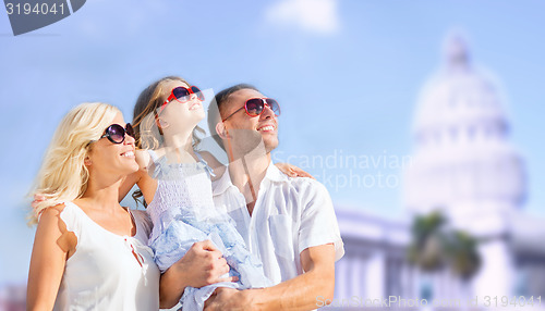 Image of happy family over american white house background