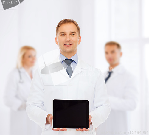 Image of smiling male doctor with tablet pc