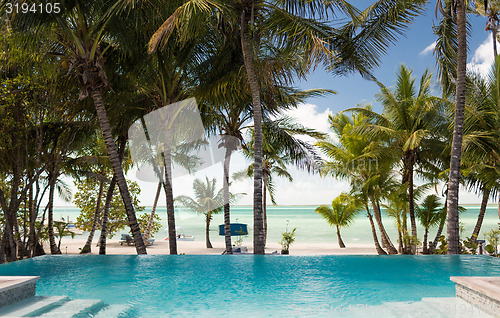 Image of swimming pool on tropical beach