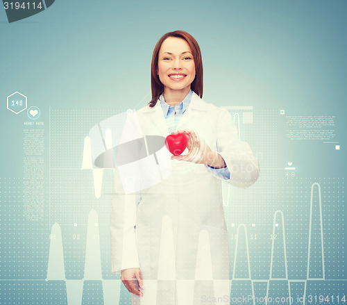 Image of smiling female doctor with heart