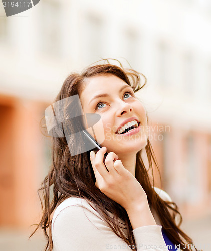 Image of young woman talking on the phone
