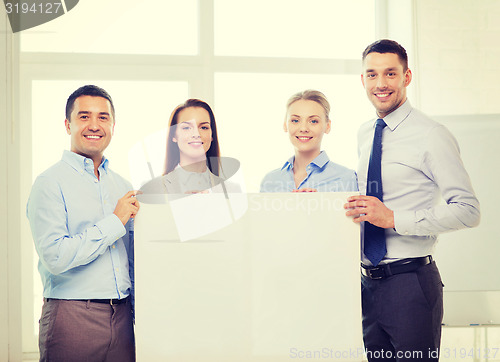 Image of business team in office with white blank board