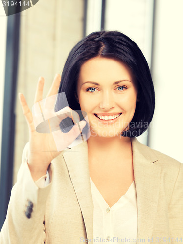 Image of young woman showing ok sign