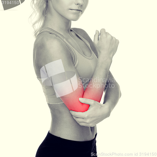 Image of sporty woman with pain in elbow