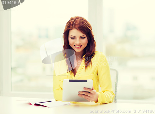 Image of student with tablet pc computer and notebook
