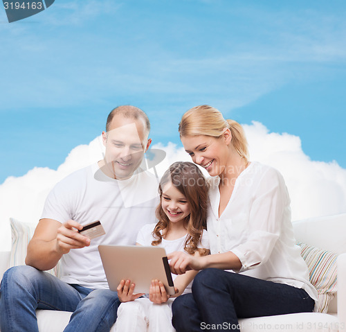 Image of happy family with tablet pc and credit card