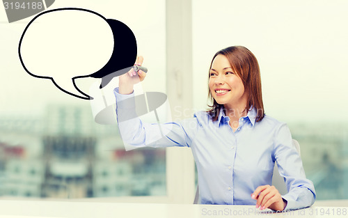 Image of businesswoman drawing text bubble