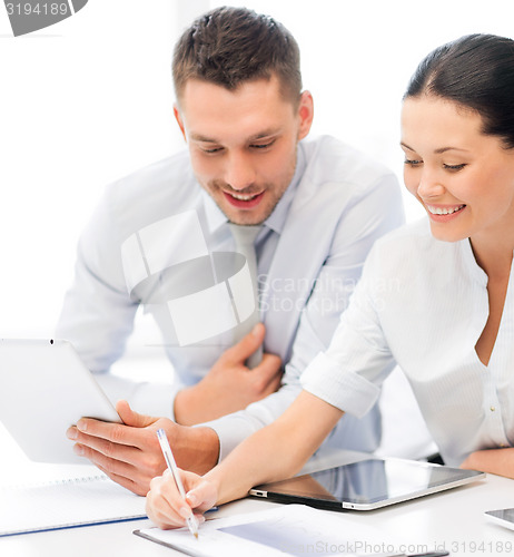 Image of business team working with tablet pcs