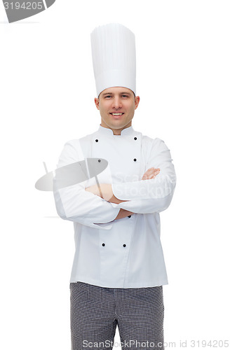 Image of happy male chef cook with crossed hands