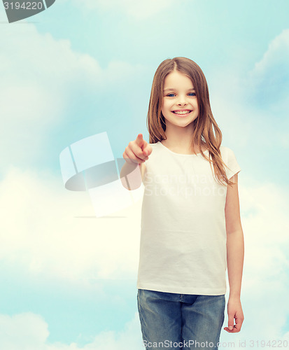 Image of little girl in blank white t-shirt pointing at you