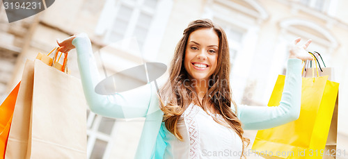 Image of woman with shopping bags in ctiy