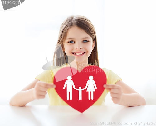 Image of smiling little girl with red heart and family