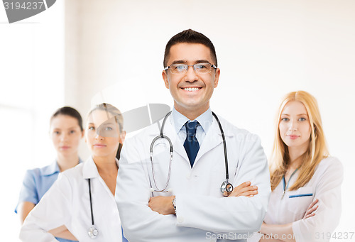 Image of smiling male doctor in white coat at hospital