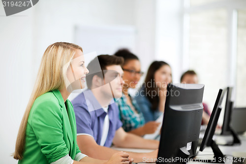 Image of students with computers studying at school