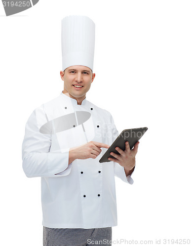 Image of happy male chef cook holding tablet pc