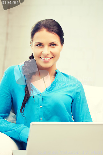 Image of happy woman with laptop computer