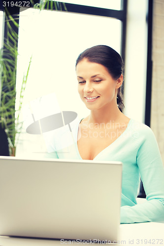 Image of happy woman with laptop computer