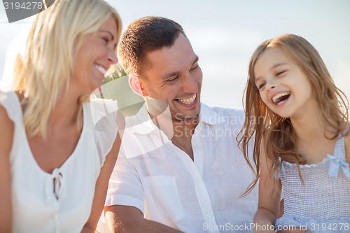 Image of happy family having a picnic