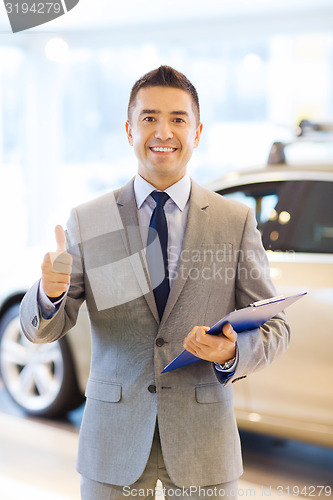 Image of happy man at auto show or car salon