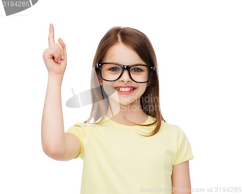Image of smiling cute little girl in black eyeglasses