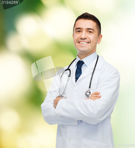 Image of smiling male doctor in white coat