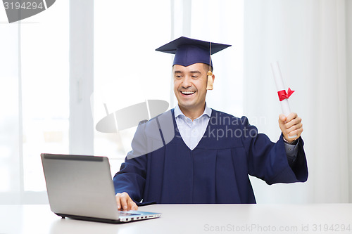 Image of smiling adult student in mortarboard with diploma