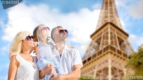 Image of happy family in paris over eiffel tower background