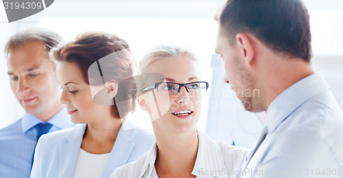 Image of man and woman having discussion in office