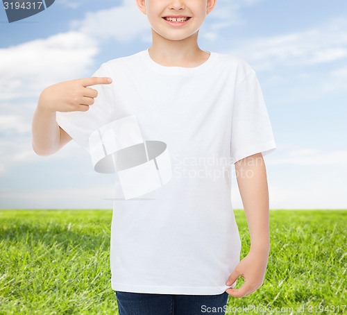 Image of smiling little boy in white blank t-shirt