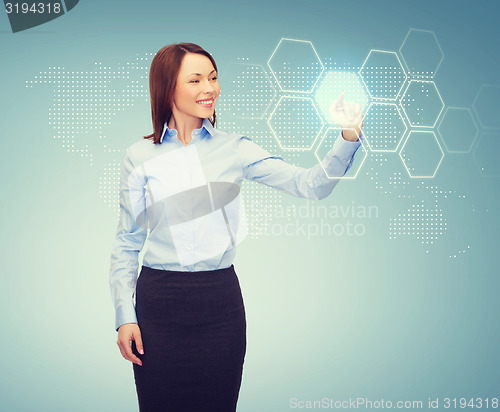 Image of smiling businesswoman working with virtual screen